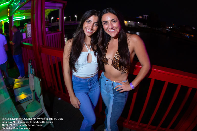two beautiful women Nightlife Photographer at Senor Frogs for Frogs Saturday Night on Sat October 2nd, 2021 Myrtle Beach, SC USA photos by Myrtle Beach photographer Beachmonkey