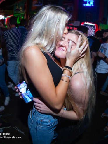 girl kissing another girl Myrtle Beach Photographer at Tongys Shmackhouse for CCU's Homecoming Party on November 11th, 2021 Conway, SC USA by Myrtle Beach photographer Beachmonkey