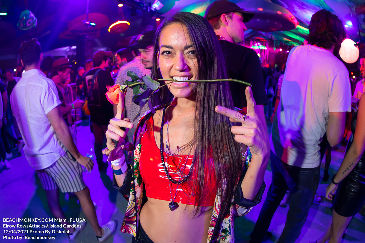 hot girl with rose Music Festival Photographer at Island Gardens for Elrow RowsAttacks promoted by Diskolab in Miami, FL USA on December 4, 2021 by Miami photographer Beachmonkey