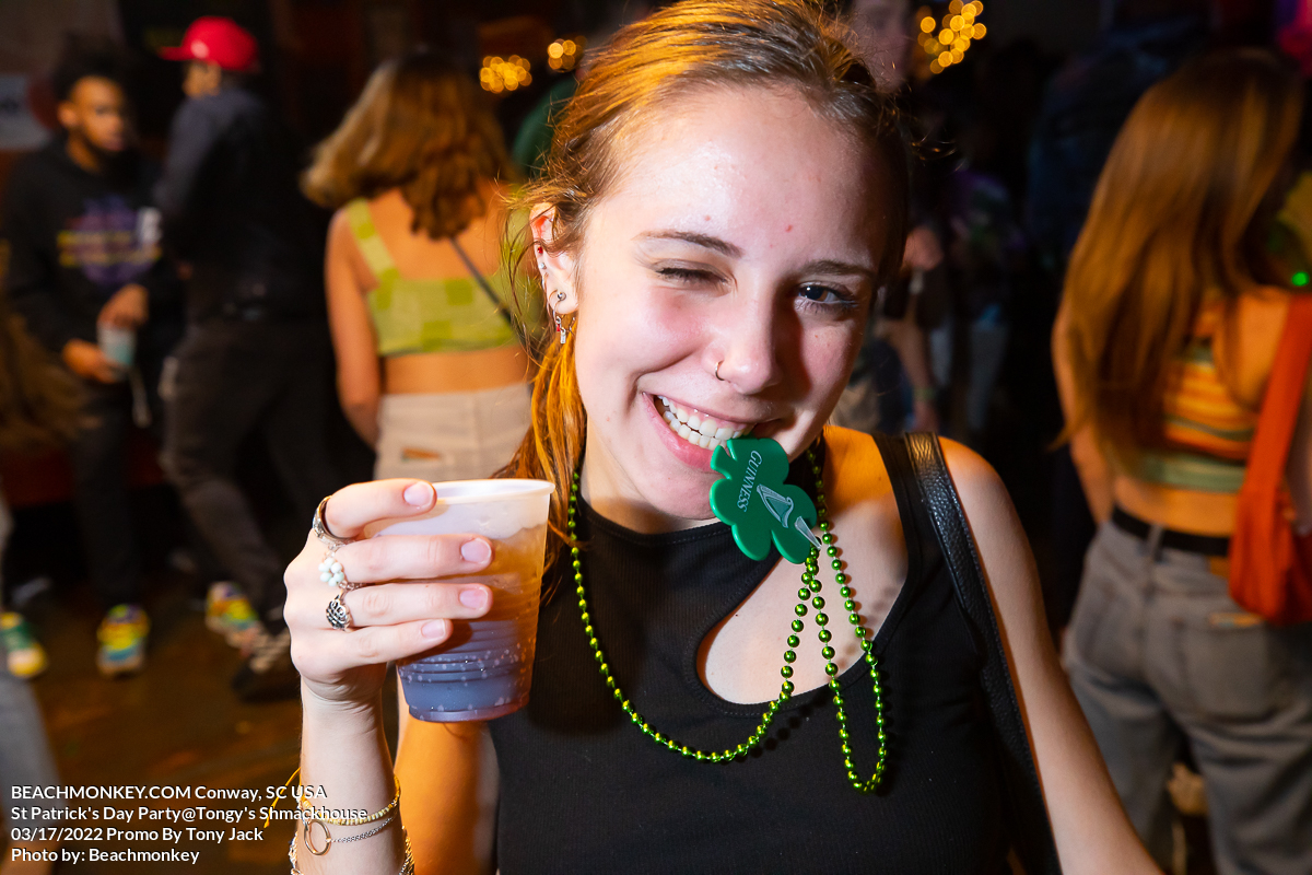hot girl drinking at Tongys Shmackhouse for St Patricks Day on march 17 2022 in Conway, SC USA photos Separator  by Myrtle Beach photographer Beachmonkey