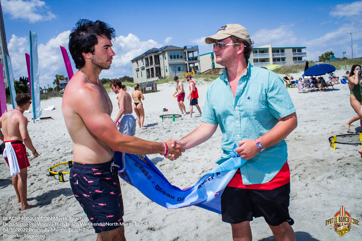 frat brothers shaking hands Delta Sigma Phi Virginia Tech Fraternity Beach Weekend in North Myrtle Beach, SC USA sponsored by Myrtlebeachtours.com April 30th 2022 Photos by Napoleon