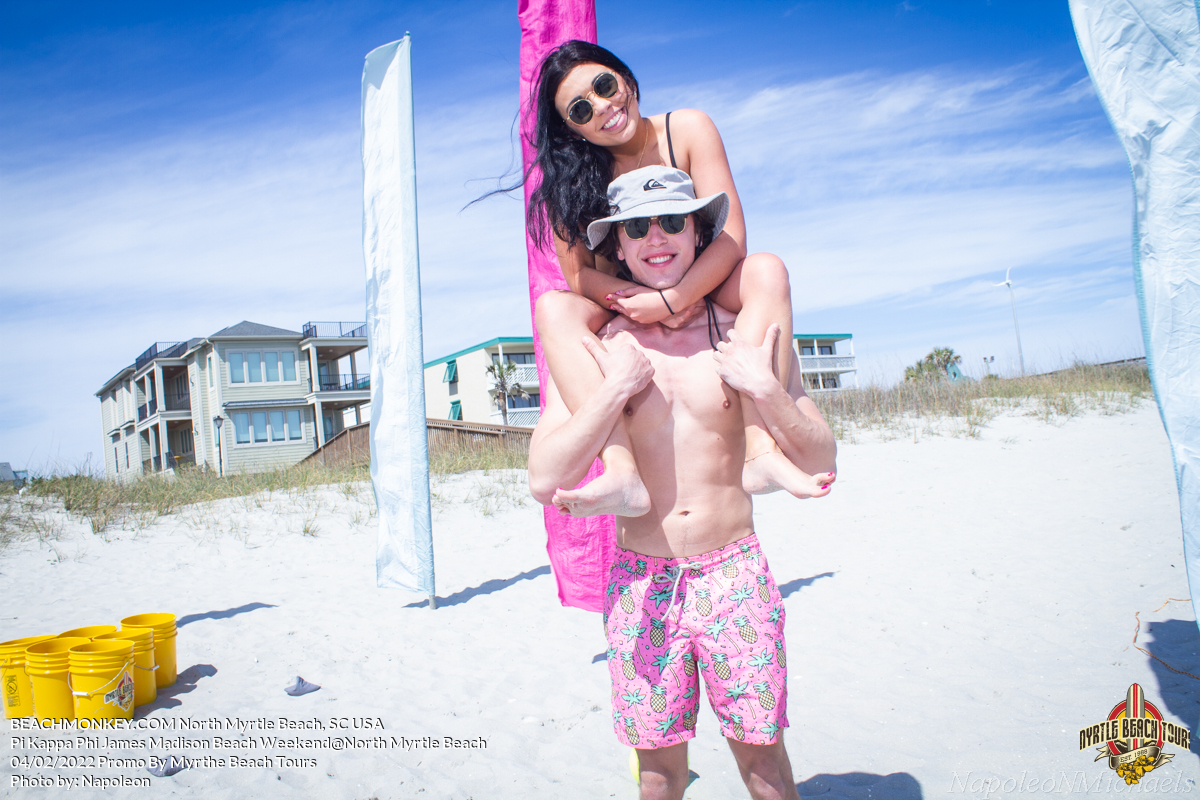 girl on guys shoulders Pi Kappa Phi James Madison University Fraternity Beach Weekend in North Myrtle Beach, SC USA sponsored by Myrtlebeachtours.com April 2nd 2022 Photos by Napoleon