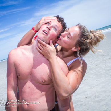 girl kissing guy Pi Kappa Phi James Madison University Fraternity Beach Weekend in North Myrtle Beach, SC USA sponsored by Myrtlebeachtours.com April 2nd 2022 Photos by Napoleon