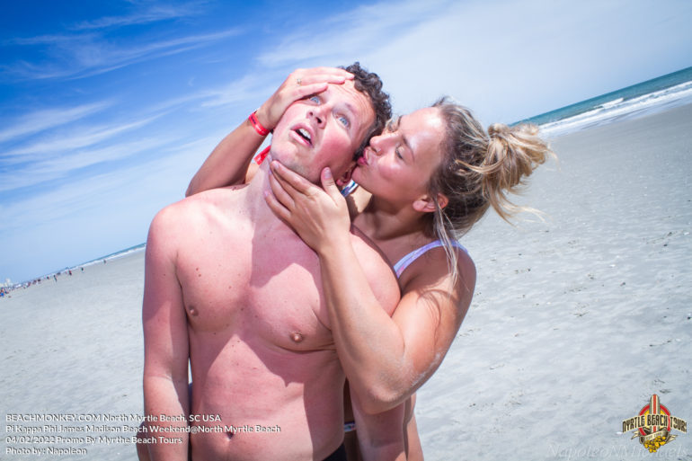 girl kissing guy Pi Kappa Phi James Madison University Fraternity Beach Weekend in North Myrtle Beach, SC USA sponsored by Myrtlebeachtours.com April 2nd 2022 Photos by Napoleon