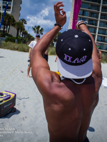 guy playing beer pong Pi Lambda Phi Virginia Tech Fraternity Beach Weekend in North Myrtle Beach, SC USA sponsored by Myrtlebeachtours.com April 30th 2022 Photos by Napoleon