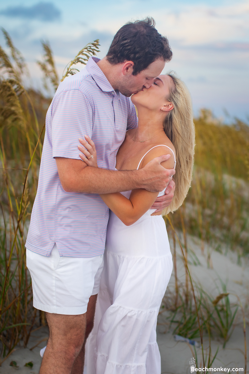Happy newly engaged couple kissing in North Myrtle Beach july 2022 Photo by Beachmonkey photography
