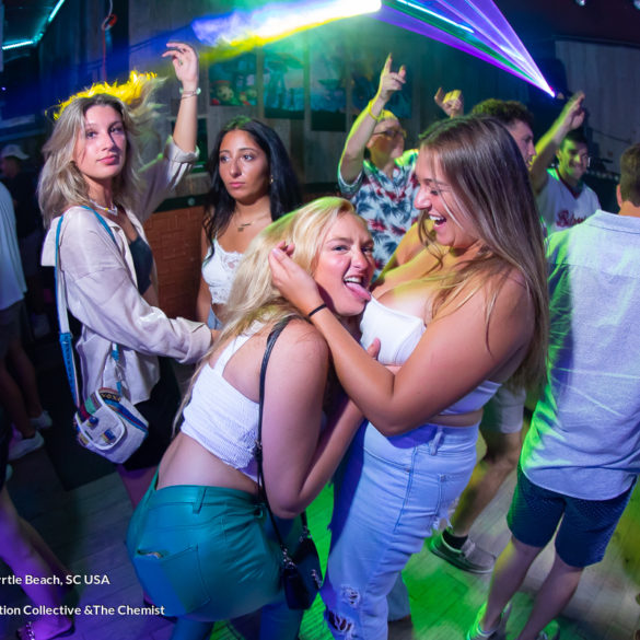 girl kissing girl at chemist myrtle beach july 2022