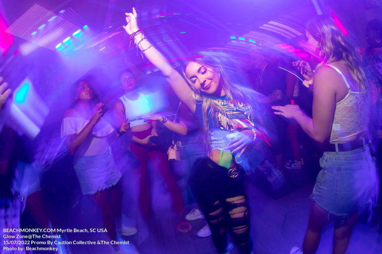 girl dancing at the Chemist for Glow zone July 15 2022 Myrtle Beach, SC USA photo by Myrtle Beach photographer Beachmonkey