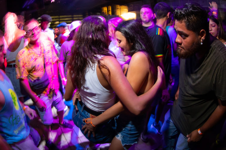 two girls from colombia dancing at College international night at sharkeys in Myrtle Beach, SC ﻿﻿Separator ﻿﻿ Photos by Myrtle Beach photographer Beachmonkey on August 8th, 2022