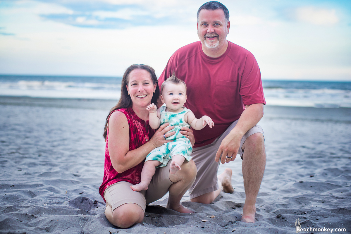 baby and proud grand parents A family Beach photo shoot in North Myrtle Beach, SC with Alisha's family by Beachmonkey of beachmonkey photography, a family photographer on July 19th 2022