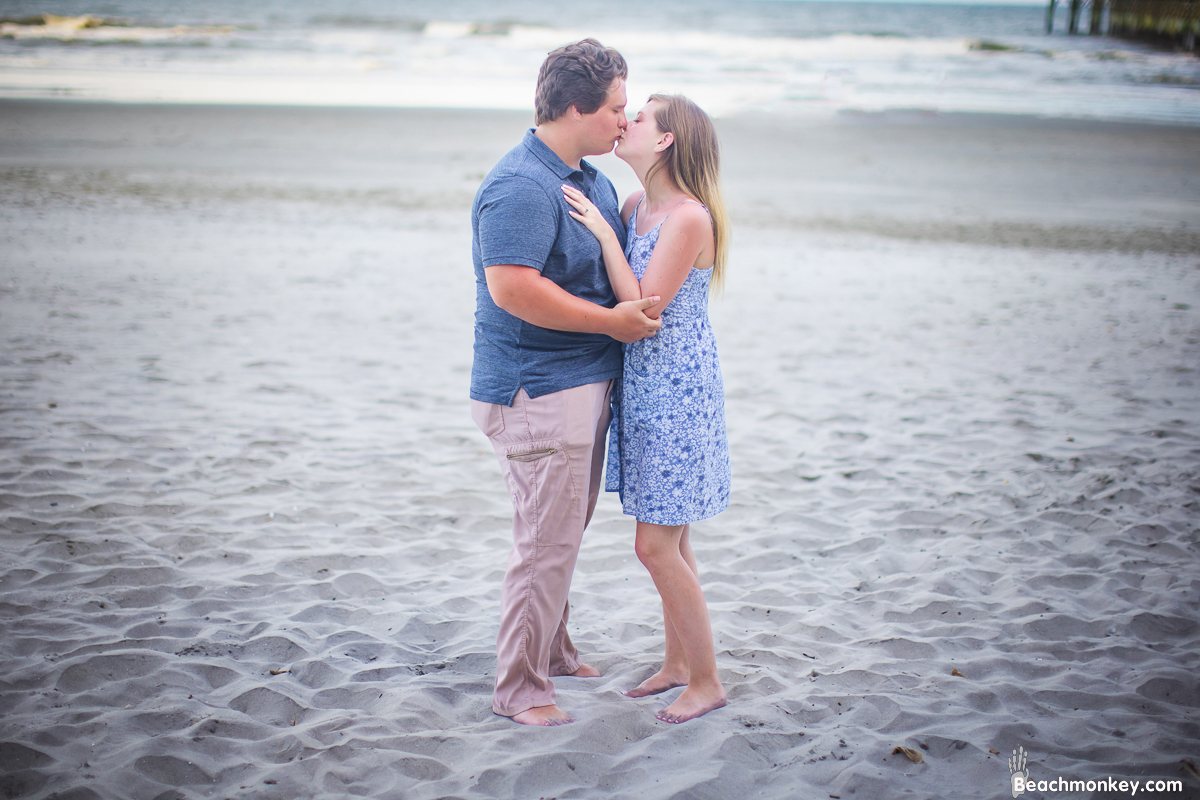 kissing couple A family Beach photo shoot in North Myrtle Beach, SC with Alisha's family by Beachmonkey of beachmonkey photography, a family photographer on July 19th 2022