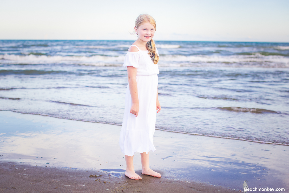 a child shot during A family Beach photo shoot in North Myrtle Beach, SC with Ashlie's family by Beachmonkey of beachmonkey photography, a family photographer on August 4th 2022