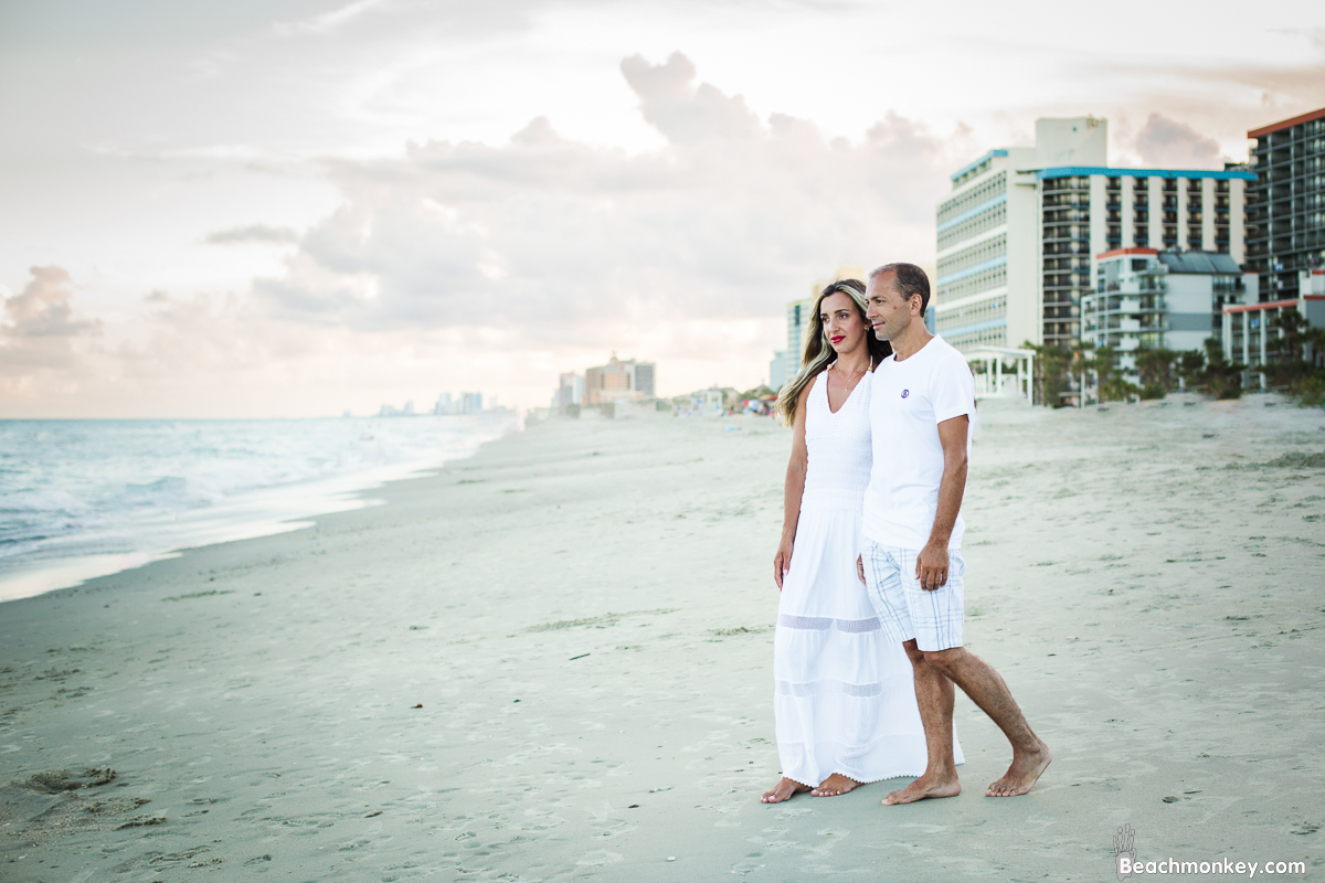 happy couple A family Beach photo shoot in Myrtle Beach, SC USA with Irena's family by Slava of beachmonkey photography, a family photographer on August 6th 2022