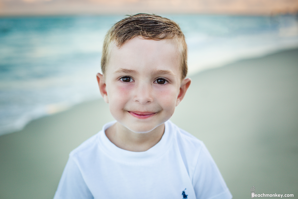 Little Boy smiling A family Beach photo shoot in Myrtle Beach, SC USA with Irena's family by Slava of beachmonkey photography, a family photographer on August 6th 2022