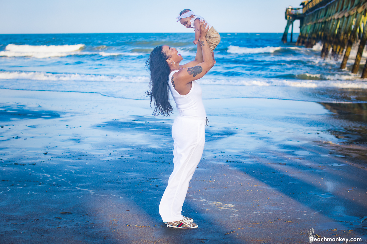 mom and baby A family Beach photo shoot in Myrtle Beach, SC with Jasmine's family by Beachmonkey of beachmonkey photography, a family photographer on July 21st 2022