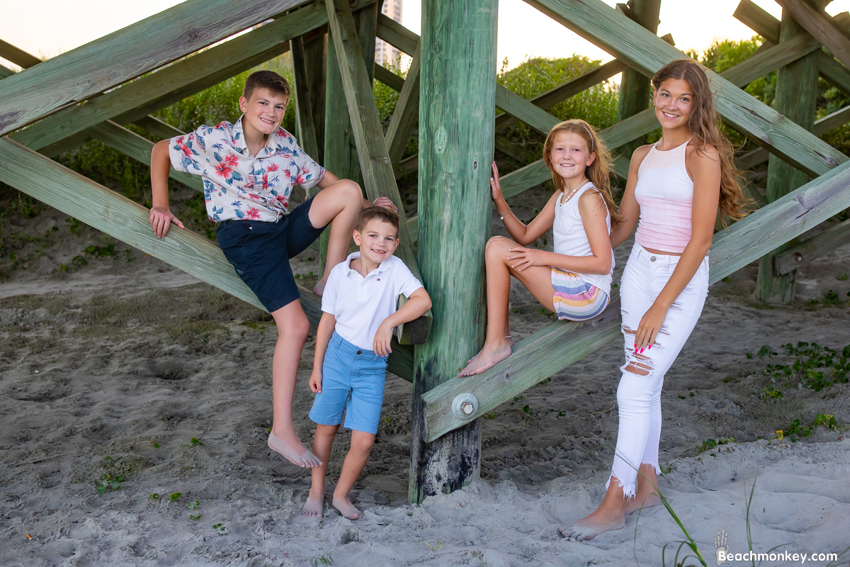 A family photo shoot in Myrtle Beach, SC at Apache Pier in Myrtle Beach with Jonathan's family by beachmonkey photography, a family photographer in July 2022