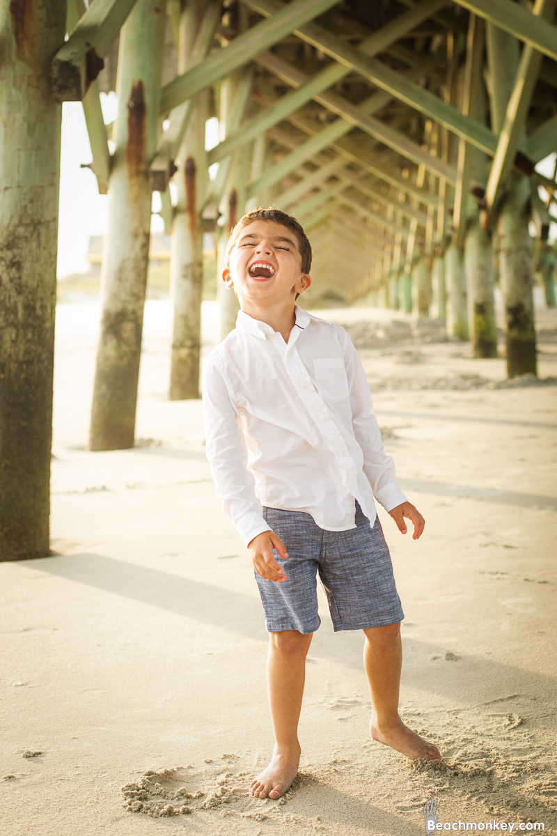 kid yelling at A family Beach photo shoot in Myrtle Beach, SC USA with Kerry's family by Slava of beachmonkey photography, a family photographer on July 18th 2022