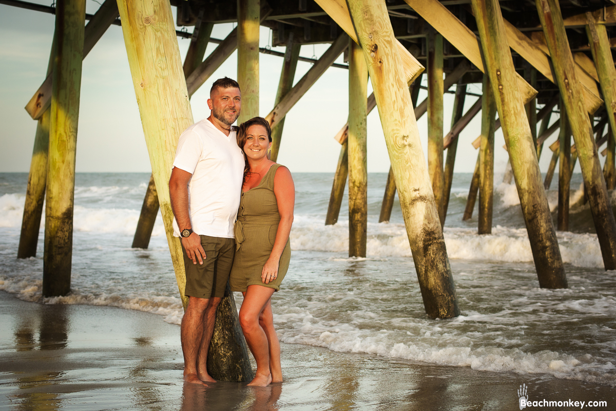 happy couple at A family photo shoot in Myrtle Beach, SC at Myrtle Beach State Park with Larry's family by Slava of beachmonkey photography, a family photographer July 2022