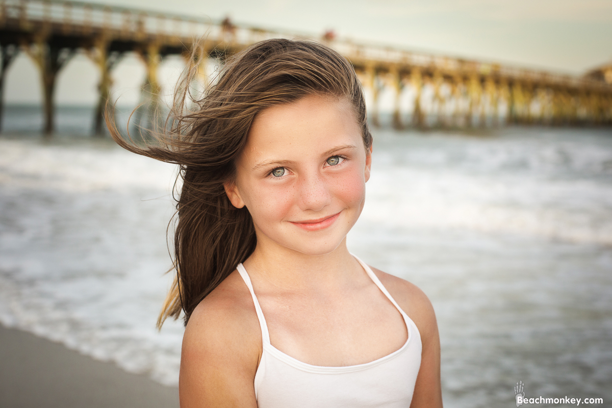 girl at A family photo shoot in Myrtle Beach, SC at Myrtle Beach State Park with Larry's family by Slava of beachmonkey photography, a family photographer July 2022