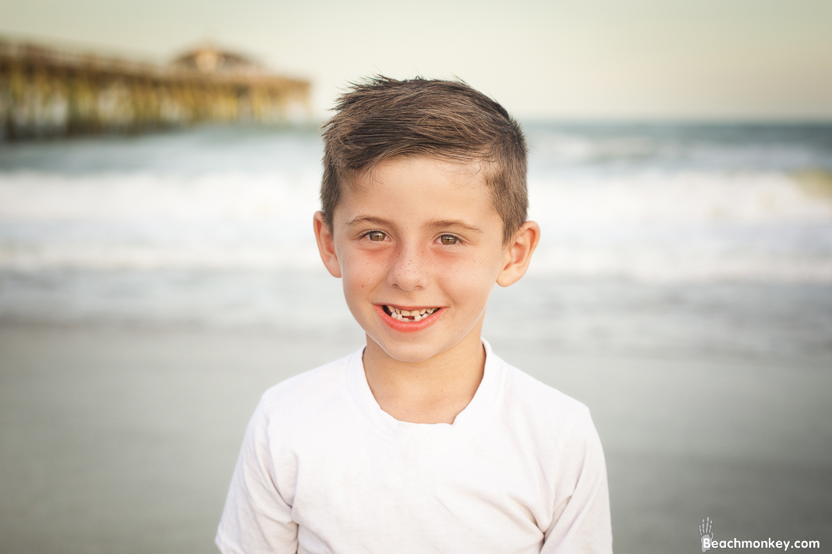 boy at A family photo shoot in Myrtle Beach, SC at Myrtle Beach State Park with Larry's family by Slava of beachmonkey photography, a family photographer July 2022