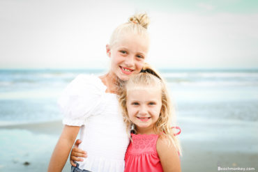 two girls on the beach A family Beach photo shoot in North Myrtle Beach, SC with Stefanie's family by Slava of beachmonkey photography, a family photographer on August 4th 2022