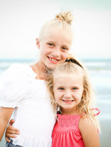 two girls on the beach A family Beach photo shoot in North Myrtle Beach, SC with Stefanie's family by Slava of beachmonkey photography, a family photographer on August 4th 2022