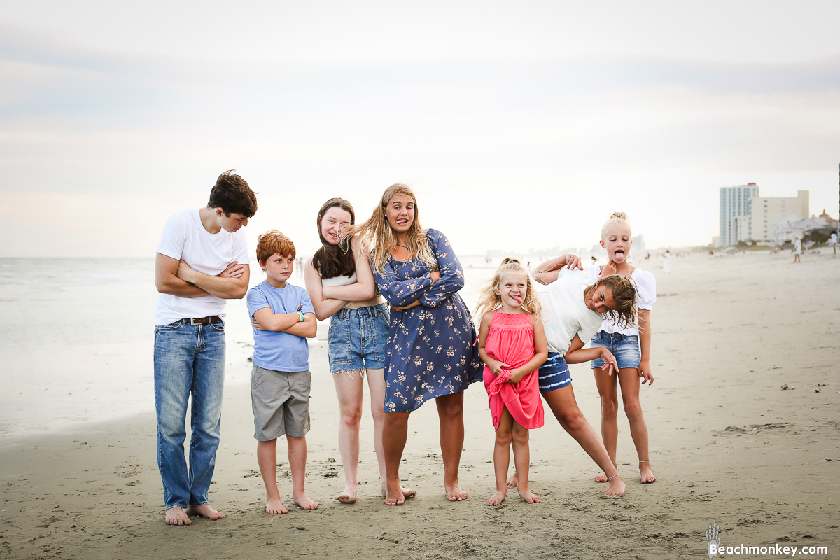Kids acting silly A family Beach photo shoot in North Myrtle Beach, SC with Stefanie's family by Slava of beachmonkey photography, a family photographer on August 4th 2022