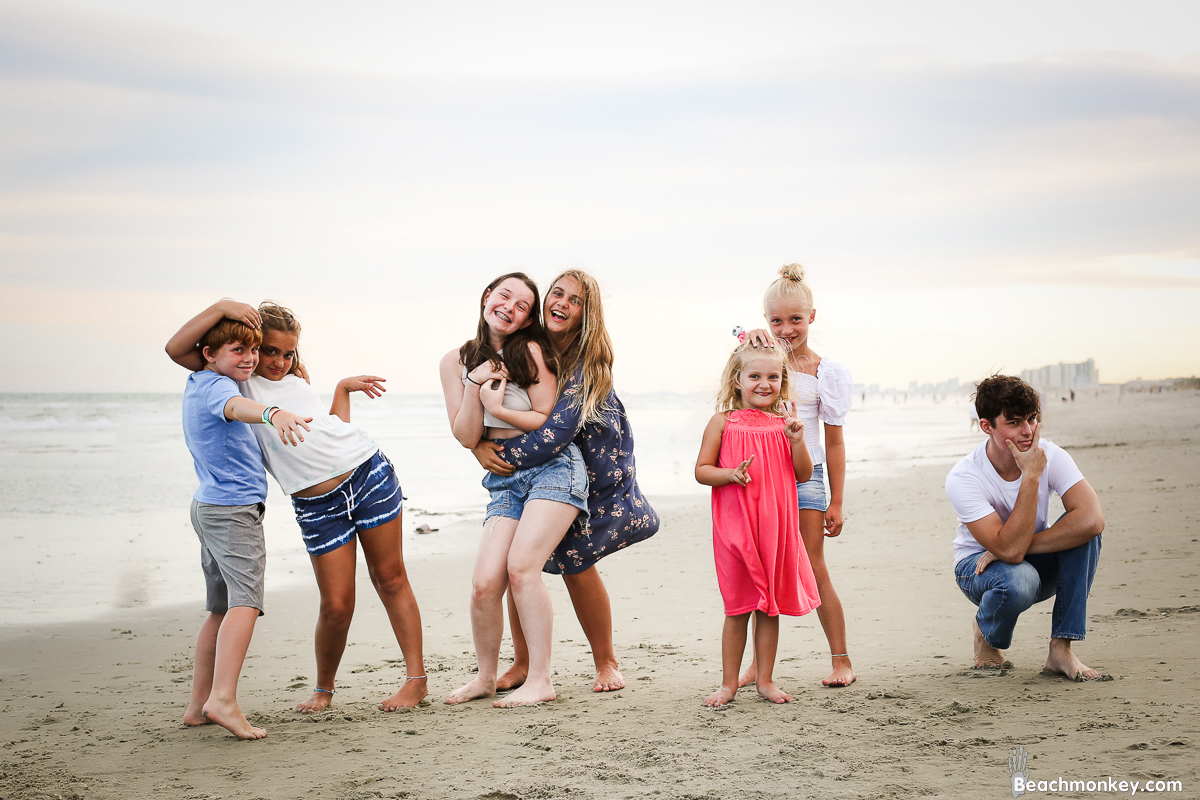 kids acting silly A family Beach photo shoot in North Myrtle Beach, SC with Stefanie's family by Slava of beachmonkey photography, a family photographer on August 4th 2022