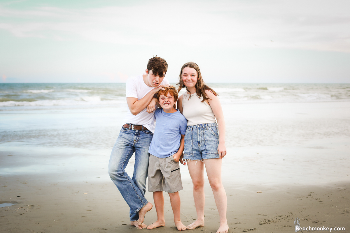 kids acting silly A family Beach photo shoot in North Myrtle Beach, SC with Stefanie's family by Slava of beachmonkey photography, a family photographer on August 4th 2022