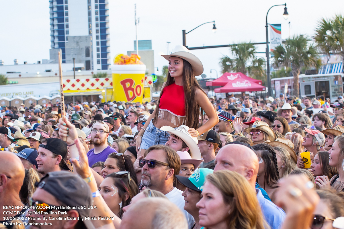 beautiful girl on shoulders at Carolina Country Music Festival Day Two June 10th, 2022 in Myrtle Beach, SC USA photos by Myrtle Beach photographer Beachmonkey