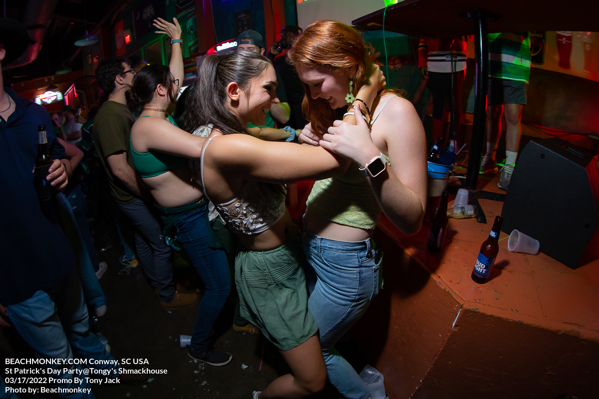 two girls dancing at Tongys Shmackhouse for St Patricks Day on march 17 2022 in Conway, SC USA photos  by Myrtle Beach photographer Beachmonkey