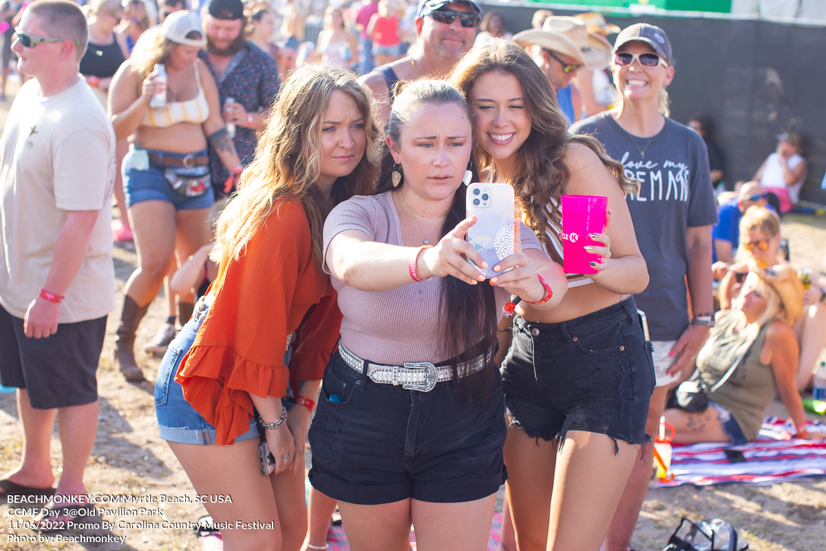 three hot girls and a selfie at Carolina Country Music Festival Day three June 11th, 2022 in Myrtle Beach, SC USA photos by Myrtle Beach photographer Beachmonkey