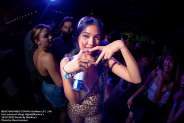 girl from thailand giving heart hands International College Nights at the Sharkey's Bar in Myrtle Beach, SC USA on August 2nd, 2022 photos by Myrtle Beach photographer Beachmonkey