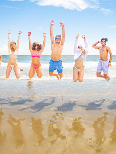 happy college fraternity kids jumping on beach Theta Tau of University of South Carolina Weekend in North Myrtle Beach, SC USA sponsored by Myrtlebeachtours.com September 3rd 2022 Photos by Beachmonkey