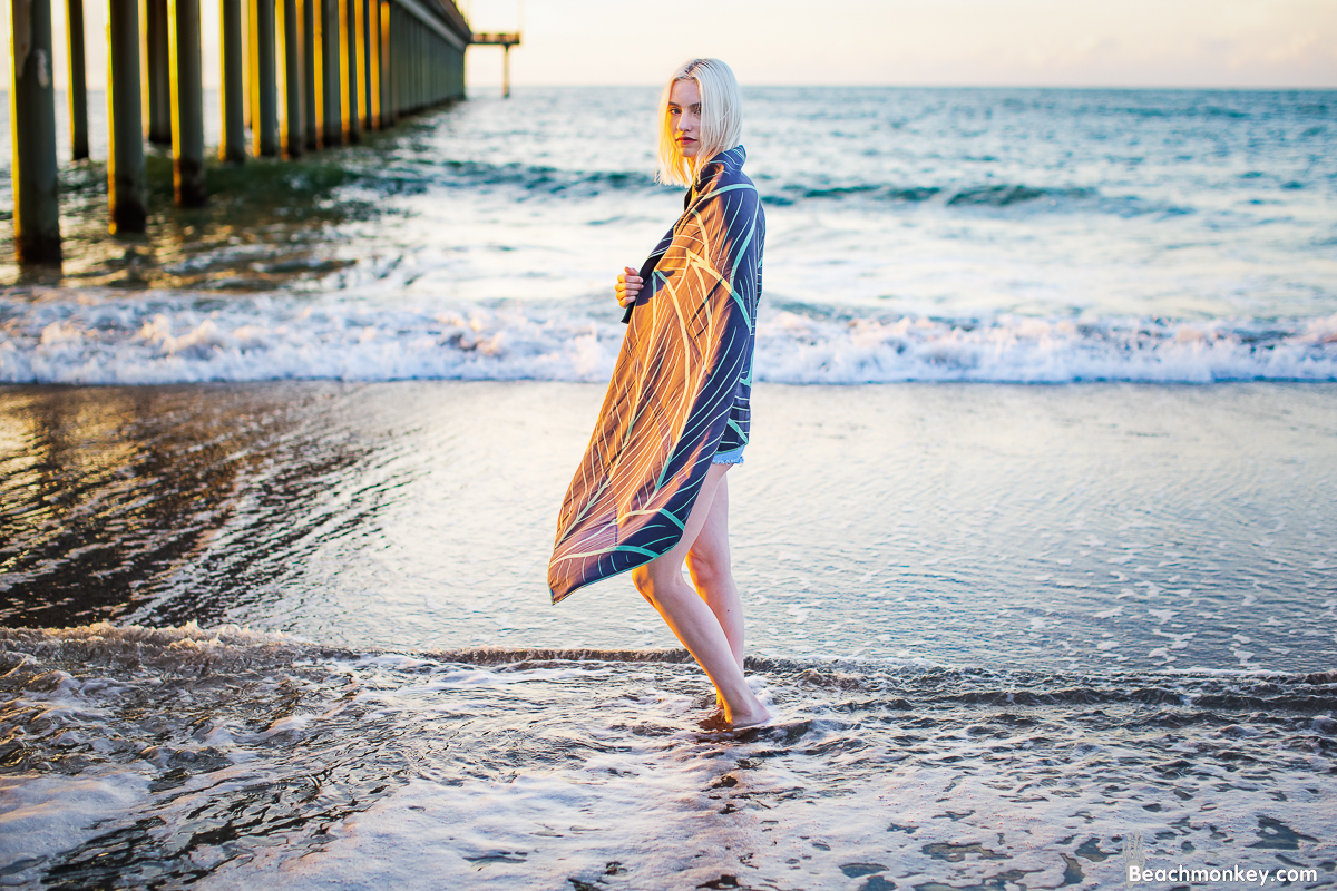 girl walking down beach wrapped in towel A Branding and Lifestyle photo shoot in Myrtle Beach, SC with Solem Towel by Beachmonkey of beachmonkey photography, a Myrtle Beach photographer, Aug 14th 2022