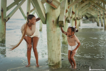 girls looking at each other A family Beach photo shoot in Myrtle Beach, SC USA with Sorangles family by Slava of beachmonkey photography, a family photographer on August 10th 2022