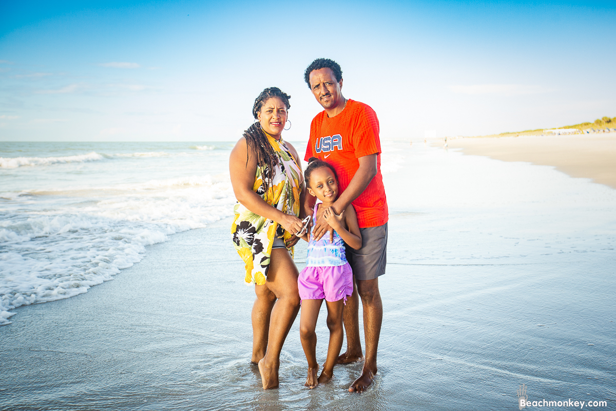 mom, dad and daughter A family Beach photo shoot in Myrtle Beach, SC USA with Tesfa's family by Slava of beachmonkey photography, a family photographer on August 9th 2022
