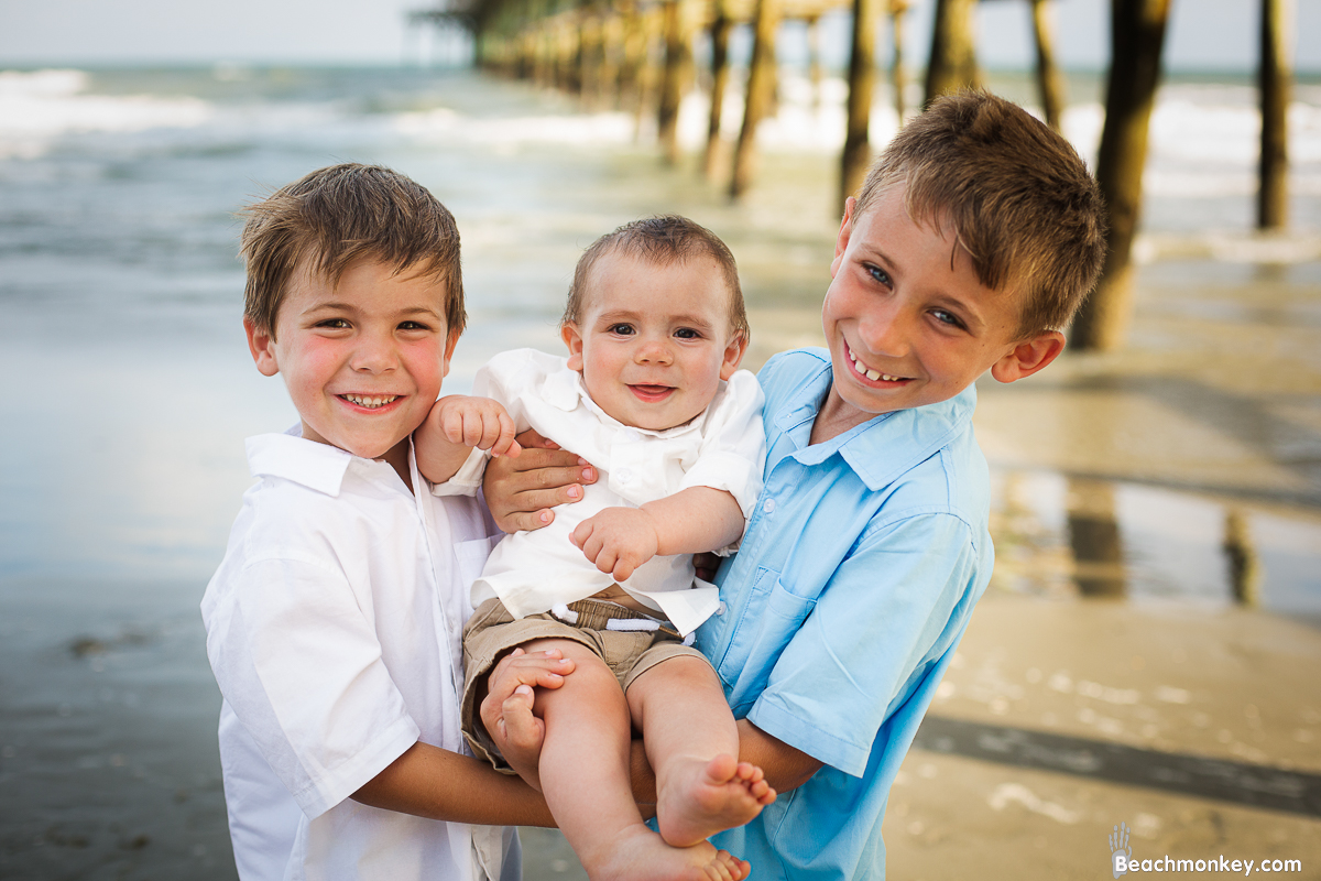 brothers together A family Beach photo shoot in North Myrtle Beach, SC with Ashley's family by Slava of beachmonkey photography, a family photographer on July 7th 2022
