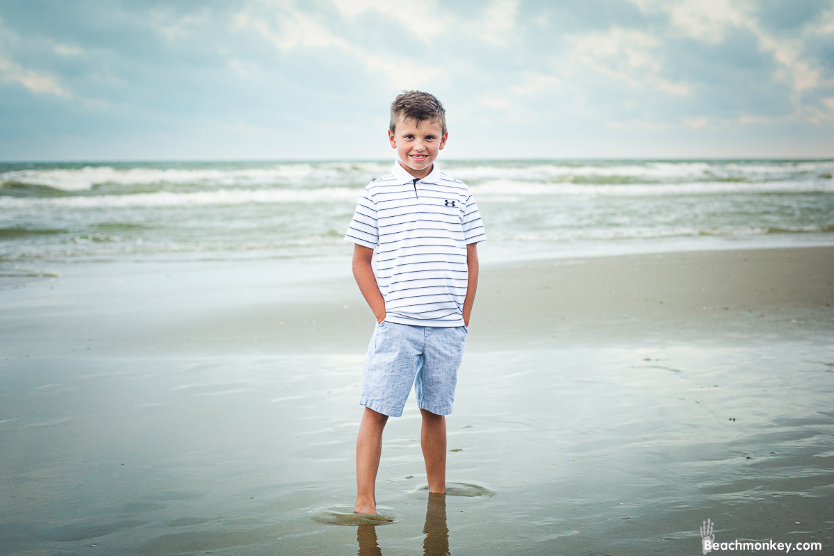 smiling boy A family Beach photo shoot in North Myrtle Beach, SC with Dana's family by Slava of beachmonkey photography, a family photographer on July 7th 2022