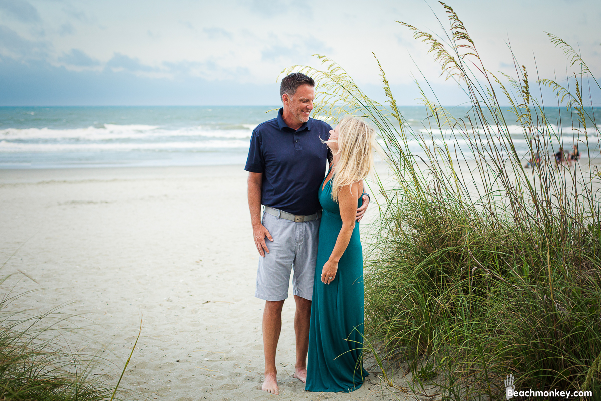 happy couple A family Beach photo shoot in North Myrtle Beach, SC with Dana's family by Slava of beachmonkey photography, a family photographer on July 7th 2022