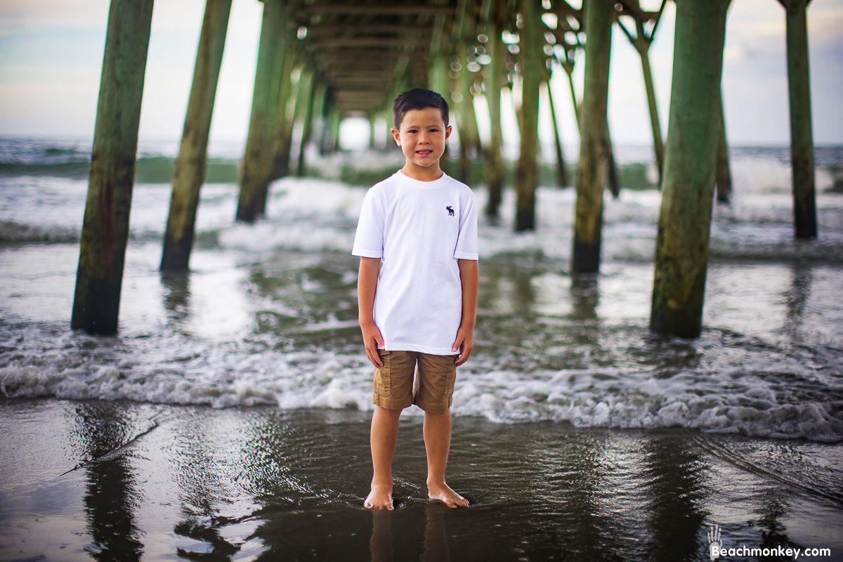 A family photo shoot in Garden City, SC Pier on July 14th, 2022 with Kally's family by Beachmonkey of beachmonkey photography, a family photographer