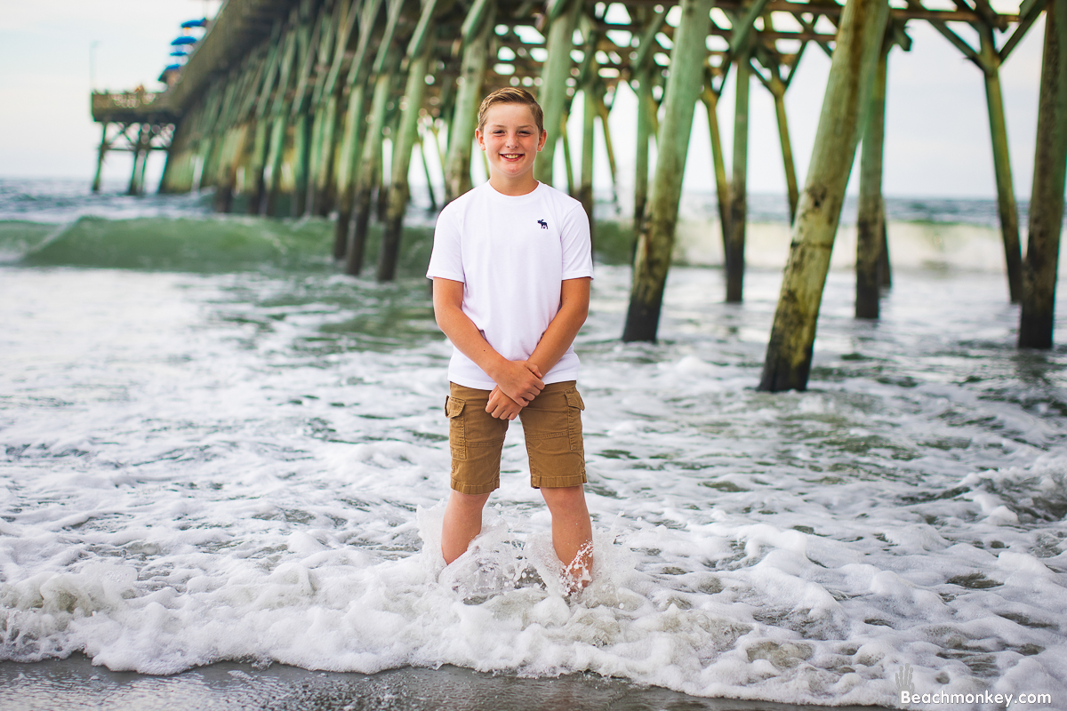 A family photo shoot in Garden City, SC Pier on July 14th, 2022 with Kally's family by Beachmonkey of beachmonkey photography, a family photographer