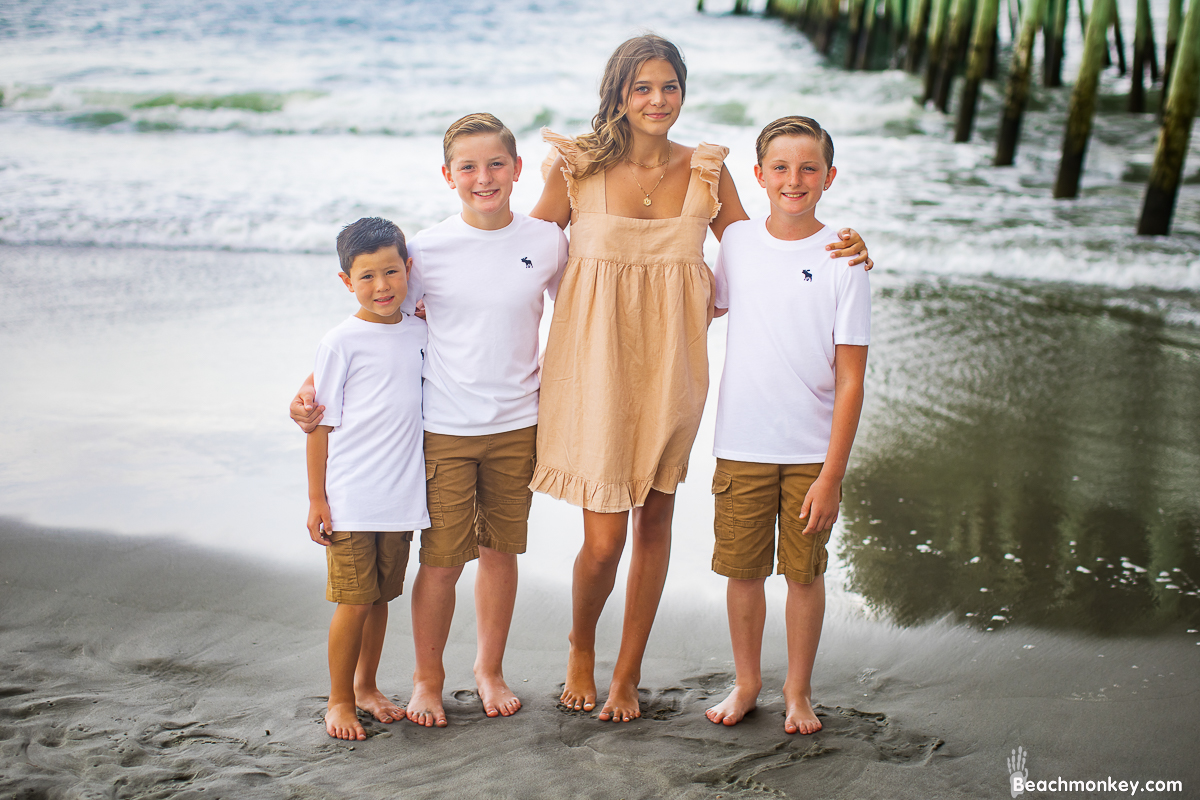 A family photo shoot in Garden City, SC Pier on July 14th, 2022 with Kally's family by Beachmonkey of beachmonkey photography, a family photographer