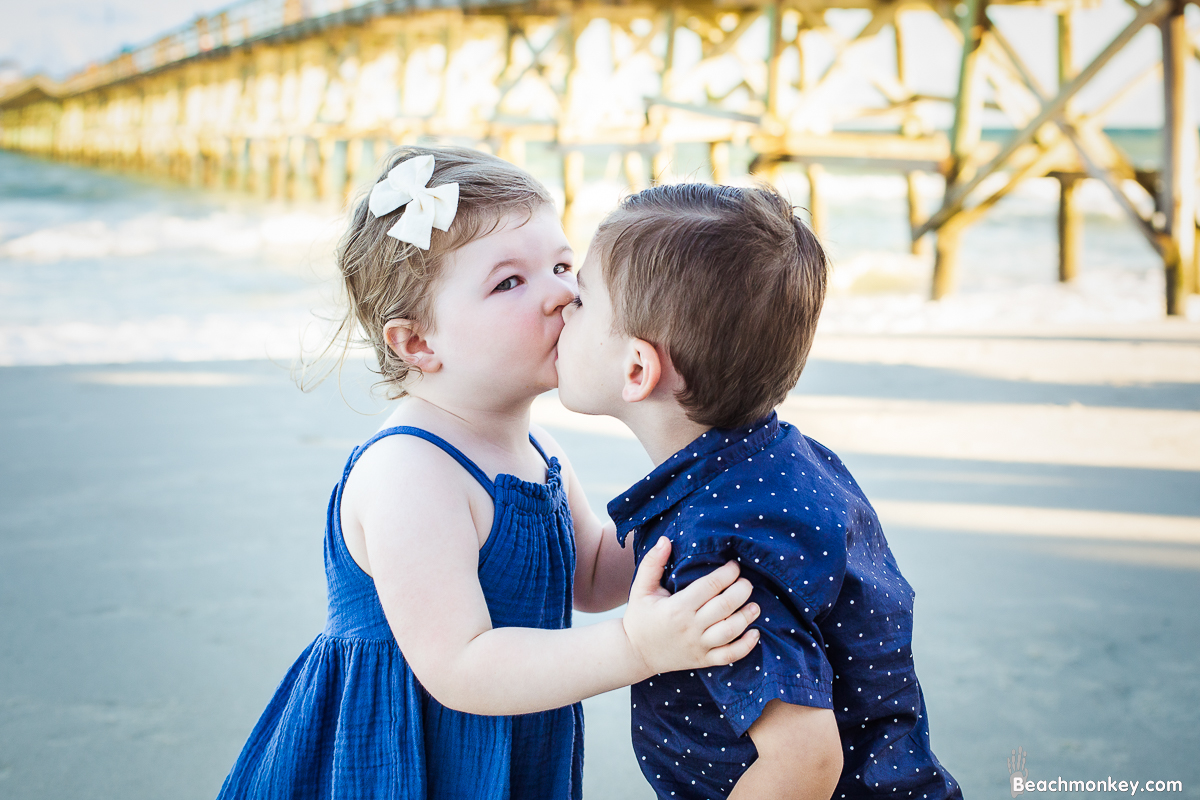 A family Beach photo shoot in North Myrtle Beach, SC with Erin's family by Slava of beachmonkey photography, a family photographer on August 8th 2022 babies kissing 