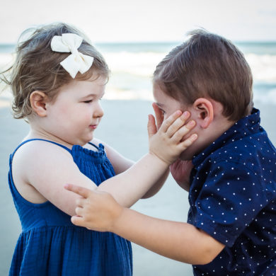 tender touch between babies A family Beach photo shoot in North Myrtle Beach, SC with Erin's family ﻿﻿Separator ﻿﻿ by Slava of beachmonkey photography, a family photographer on August 8th 2022