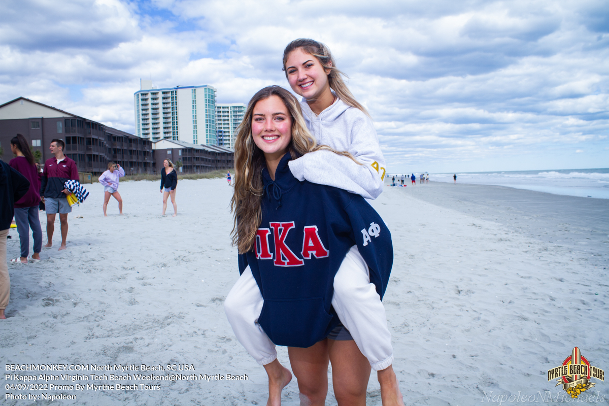 two hot sorority girls riding piggy back Pi Kappa Alpha Virginia Tech Fraternity Beach Weekend in North Myrtle Beach, SC USA sponsored by Myrtlebeachtours.com April 9th 2022 Photos by Napoleon