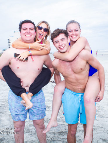 riding piggy back at Pi Sigma Epsilon Fraternity Beach Weekend in North Myrtle Beach, SC USA sponsored by Myrtlebeachtours.com April 16th 2022 Photos by Napoleon