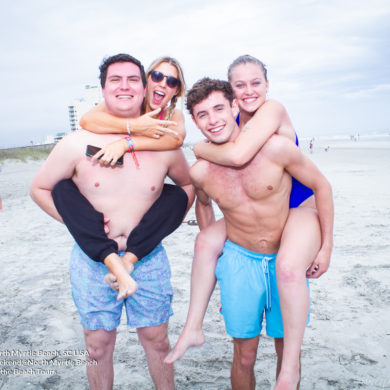 riding piggy back at Pi Sigma Epsilon Fraternity Beach Weekend in North Myrtle Beach, SC USA sponsored by Myrtlebeachtours.com April 16th 2022 Photos by Napoleon
