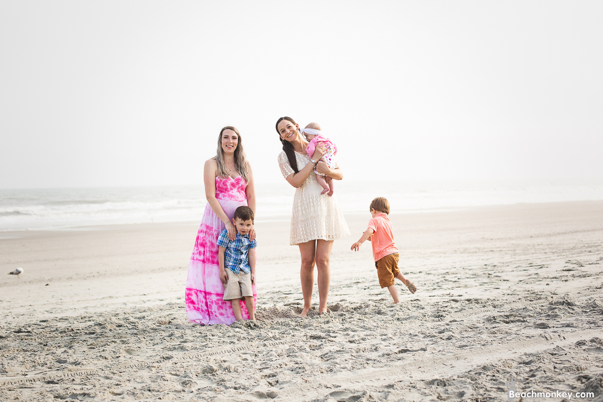 happy family A family Beach photo shoot in North Myrtle Beach, SC with Sarah's family by Slava of beachmonkey photography, a family photographer on April 6th 2022