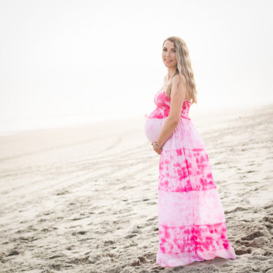 beautiful pregnant woman A family Beach photo shoot in North Myrtle Beach, SC with Sarah's family ﻿Separator ﻿ by Slava of beachmonkey photography, a family photographer on April 6th 2022